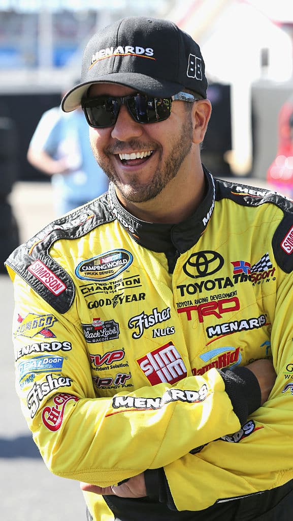 TALLADEGA, AL - OCTOBER 21:  Matt Crafton, driver of the #88 Shasta/Menards Toyota, stands in the garage area during practice for the NASCAR Camping World Truck Series fred's 250 at Talladega Superspeedway on October 21, 2016 in Talladega, Alabama.  (Photo by Jerry Markland/Getty Images)